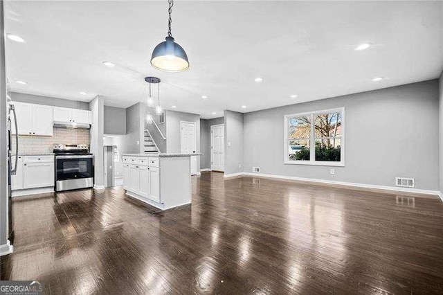 unfurnished living room with dark wood-type flooring