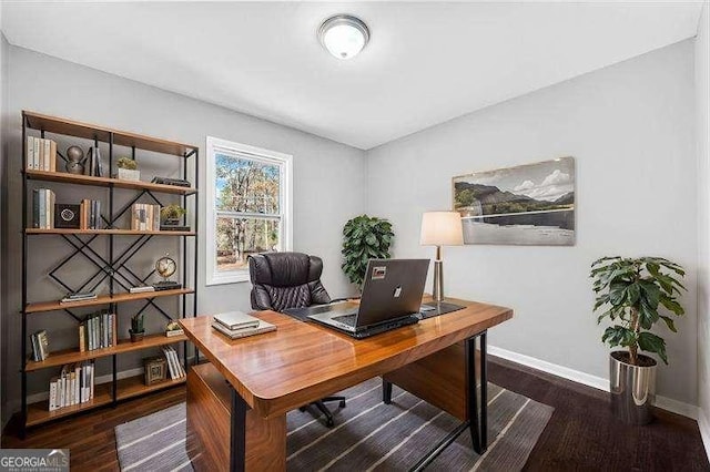 office with dark wood-type flooring