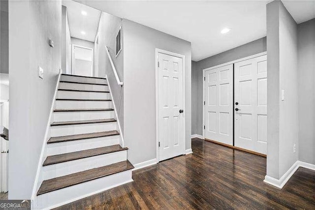 foyer with dark hardwood / wood-style flooring