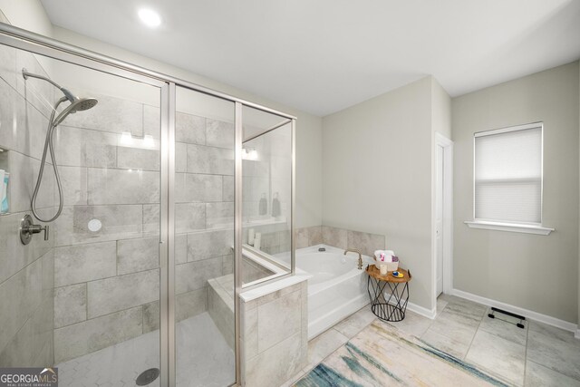 bathroom featuring independent shower and bath and tile patterned flooring