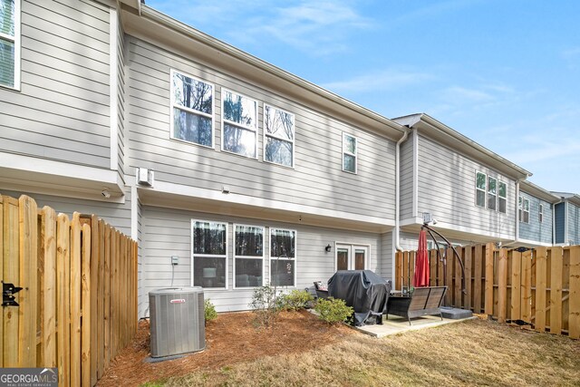 back of property featuring cooling unit, a patio, and french doors