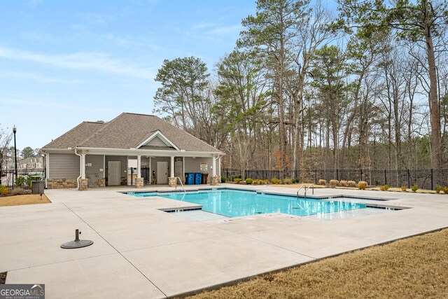 view of swimming pool featuring a patio area