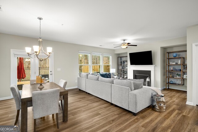 dining room with light hardwood / wood-style floors and a chandelier