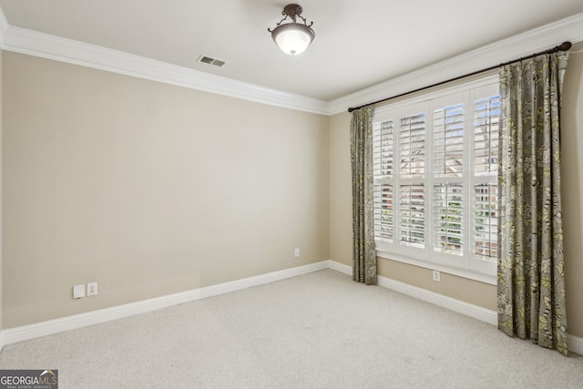 unfurnished room with crown molding and light carpet