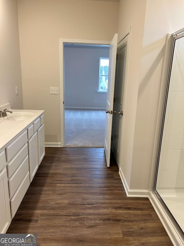16 Wildflower Ln Unit 39, Dallas, GA 30132 - full bathroom featuring a stall shower, vanity, and wood finished floors