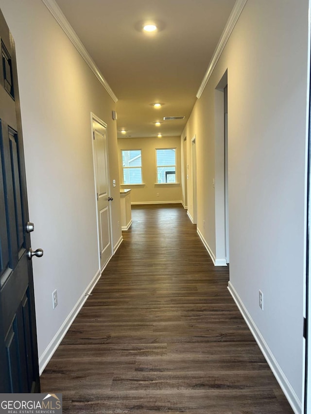 corridor with crown molding and dark hardwood / wood-style floors