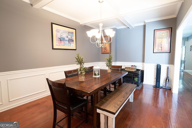 dining room with coffered ceiling, ornamental molding, dark hardwood / wood-style flooring, a notable chandelier, and beamed ceiling