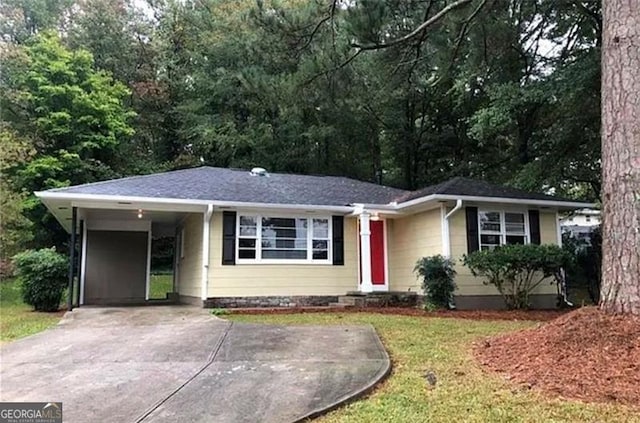 single story home featuring a carport