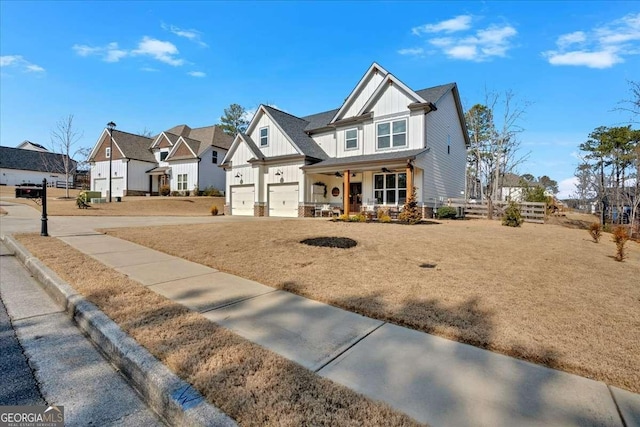 craftsman inspired home with a porch, a garage, and a front yard