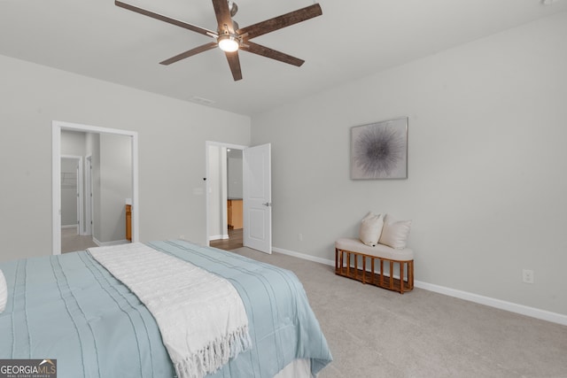 bedroom with carpet floors, visible vents, ceiling fan, and baseboards