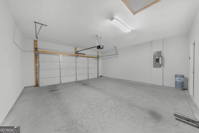 garage featuring electric panel and a garage door opener