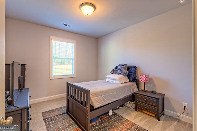 bedroom with light colored carpet