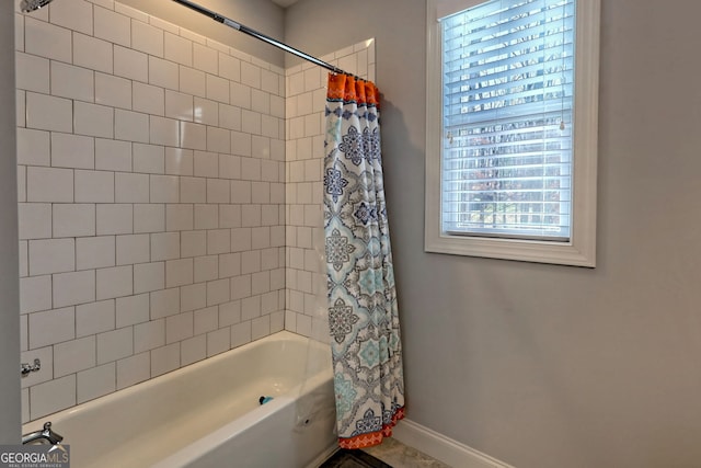 bathroom featuring shower / bathtub combination with curtain