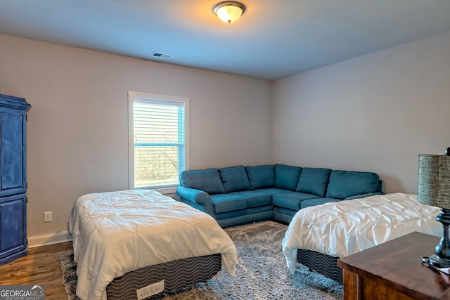 bedroom featuring dark hardwood / wood-style floors