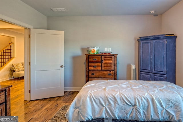 bedroom featuring hardwood / wood-style floors