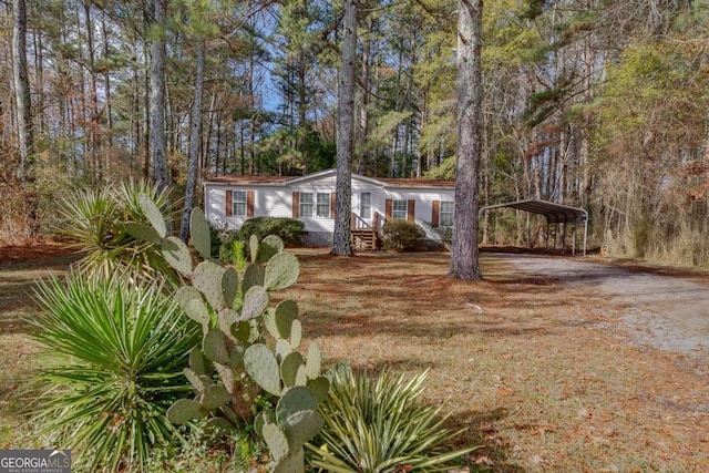 view of front of property featuring a carport