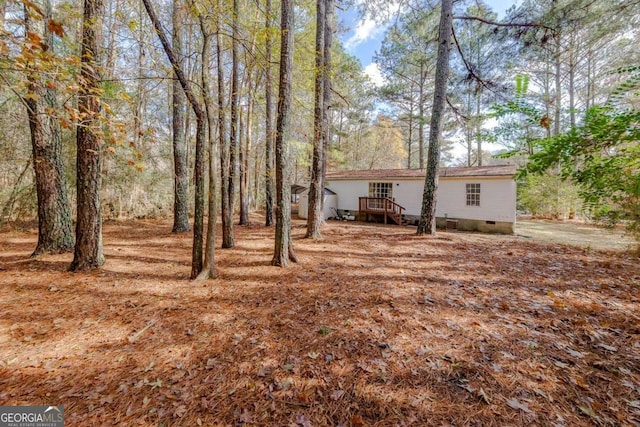 view of yard featuring a deck