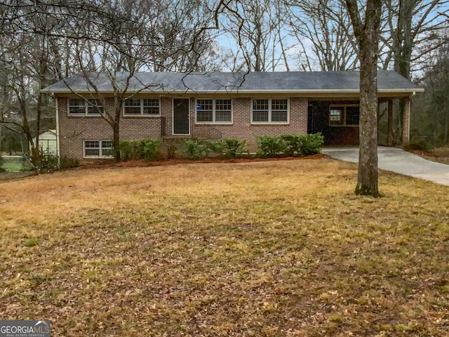 ranch-style home with a front lawn and a carport