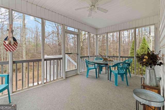 sunroom / solarium featuring ceiling fan