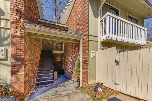 entrance to property with a balcony