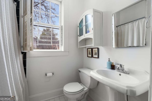 bathroom with sink and toilet