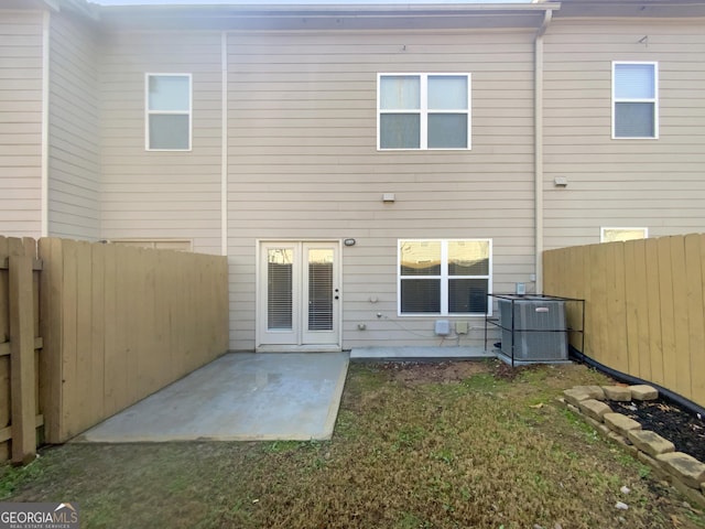 back of house with a patio, cooling unit, and a yard