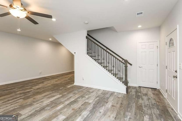 interior space featuring dark hardwood / wood-style floors and ceiling fan