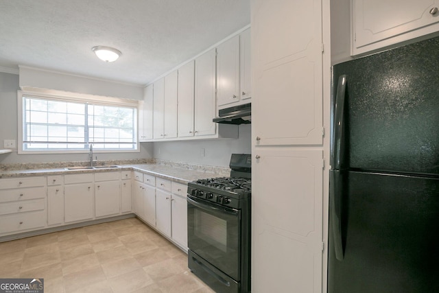 kitchen featuring white cabinets, sink, and black appliances