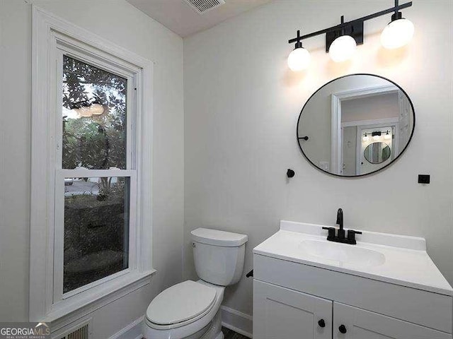 bathroom with vanity and toilet