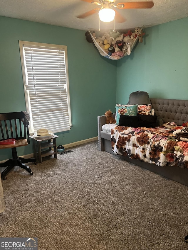 bedroom featuring a ceiling fan, carpet flooring, and baseboards