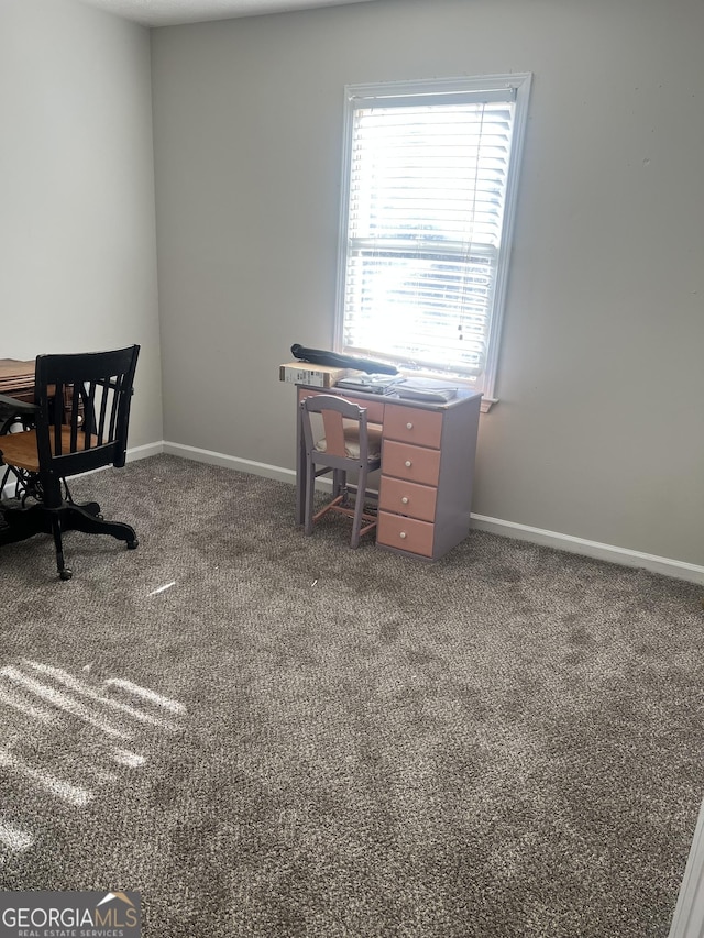 carpeted office with baseboards