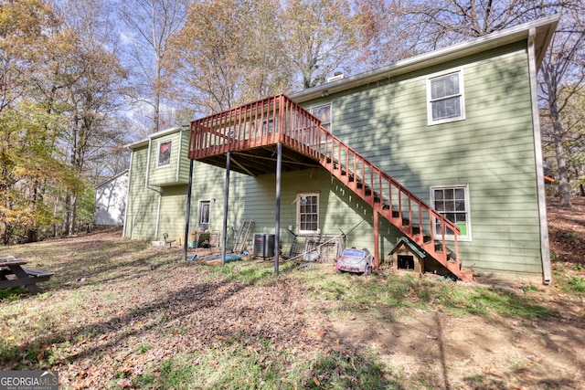 back of property featuring a deck, stairway, and central air condition unit