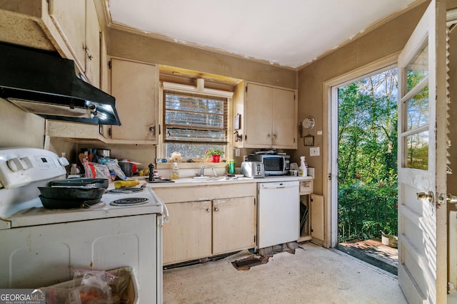 kitchen featuring sink, white appliances, and cream cabinetry