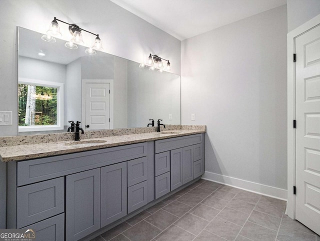 bathroom with tile patterned flooring and vanity