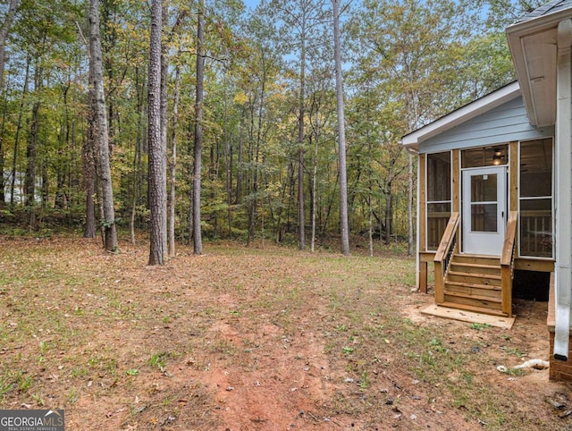 view of yard with a sunroom