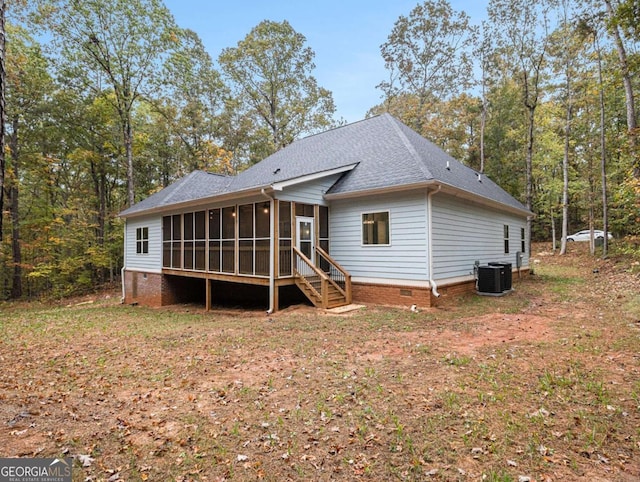 rear view of house featuring a sunroom and cooling unit