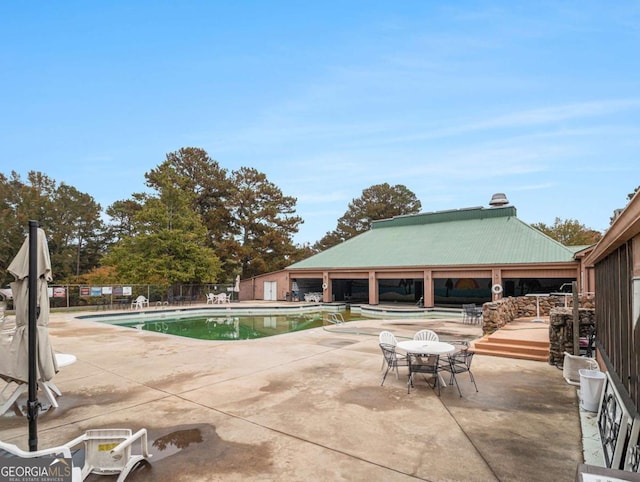 view of swimming pool with a gazebo and a patio area