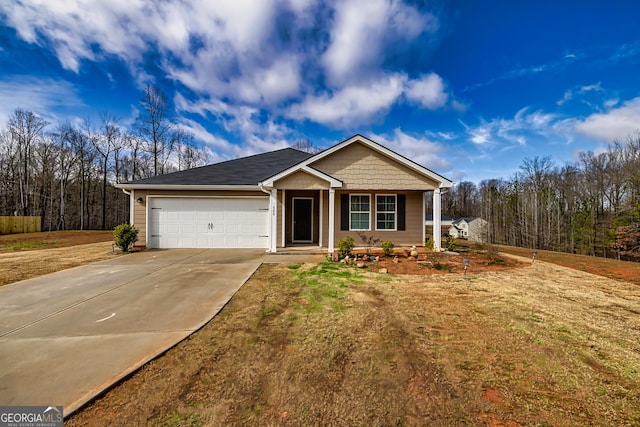 view of front of home featuring a garage and a front lawn