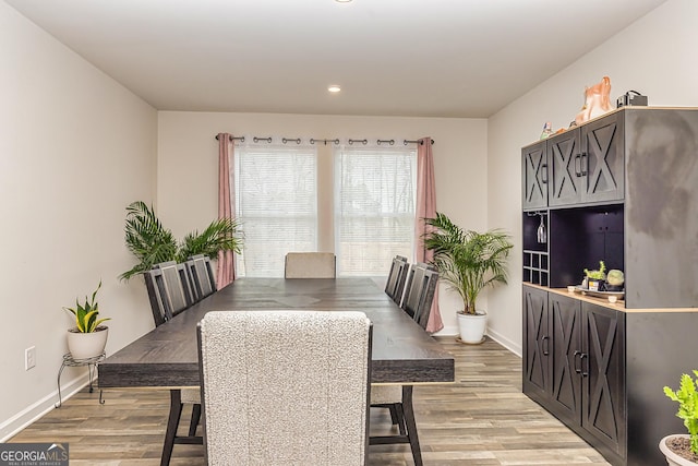 dining area with light hardwood / wood-style flooring