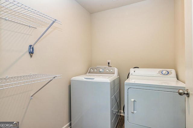 laundry room featuring washing machine and dryer