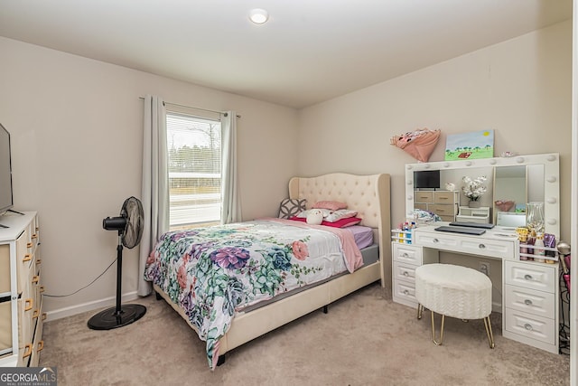 bedroom featuring light colored carpet