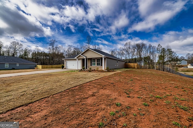 single story home featuring a garage and a front yard