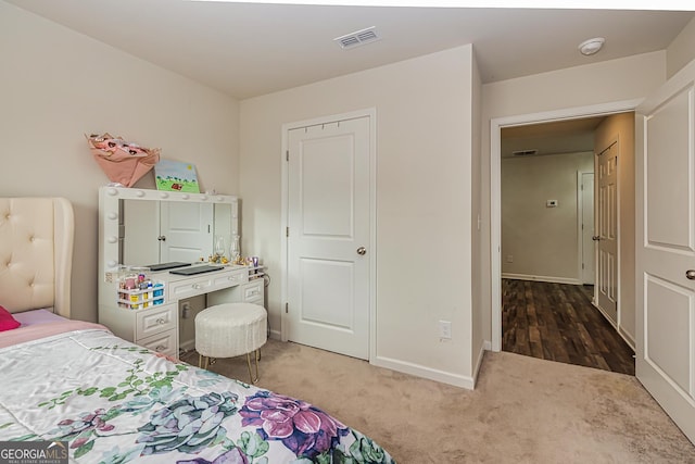 bedroom featuring dark colored carpet