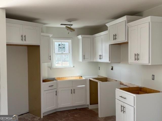 kitchen featuring white cabinetry