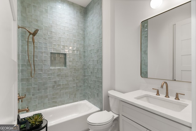 full bathroom with tiled shower / bath combo, vanity, and toilet