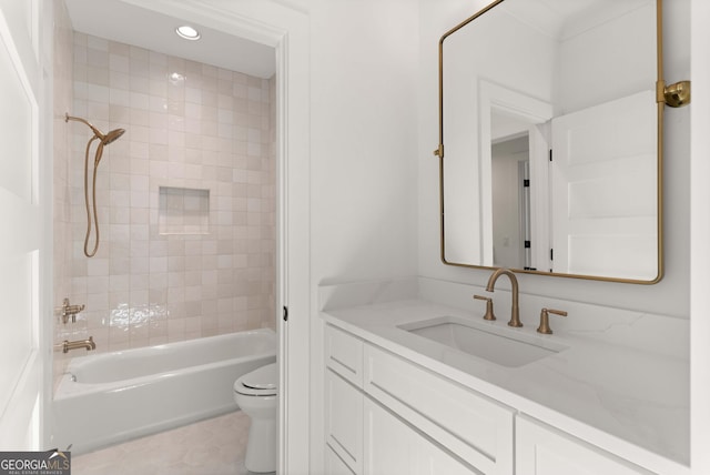 full bathroom with vanity, tile patterned floors, toilet, and tiled shower / bath