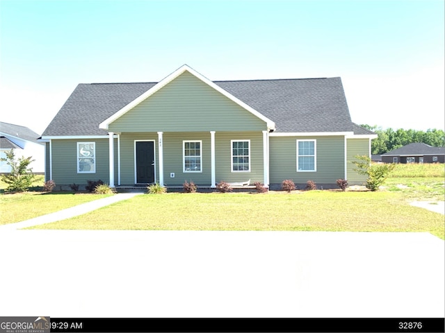 view of front of house with a porch and a front lawn