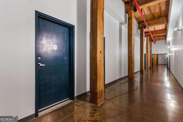 hallway with beamed ceiling