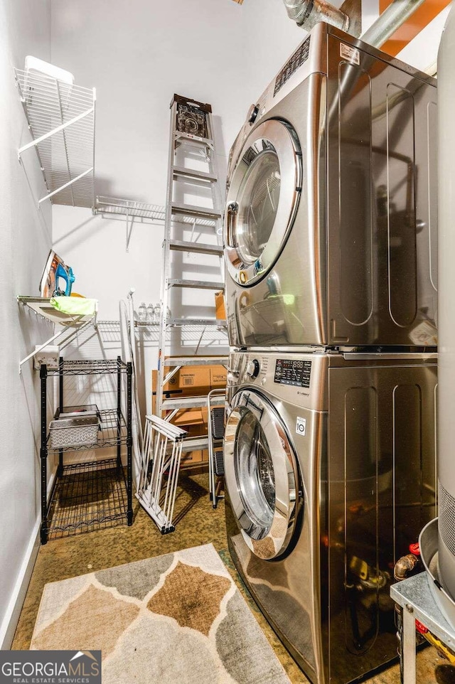 laundry area with stacked washer and dryer