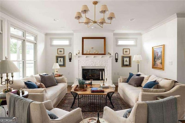 living room featuring ornamental molding and a notable chandelier